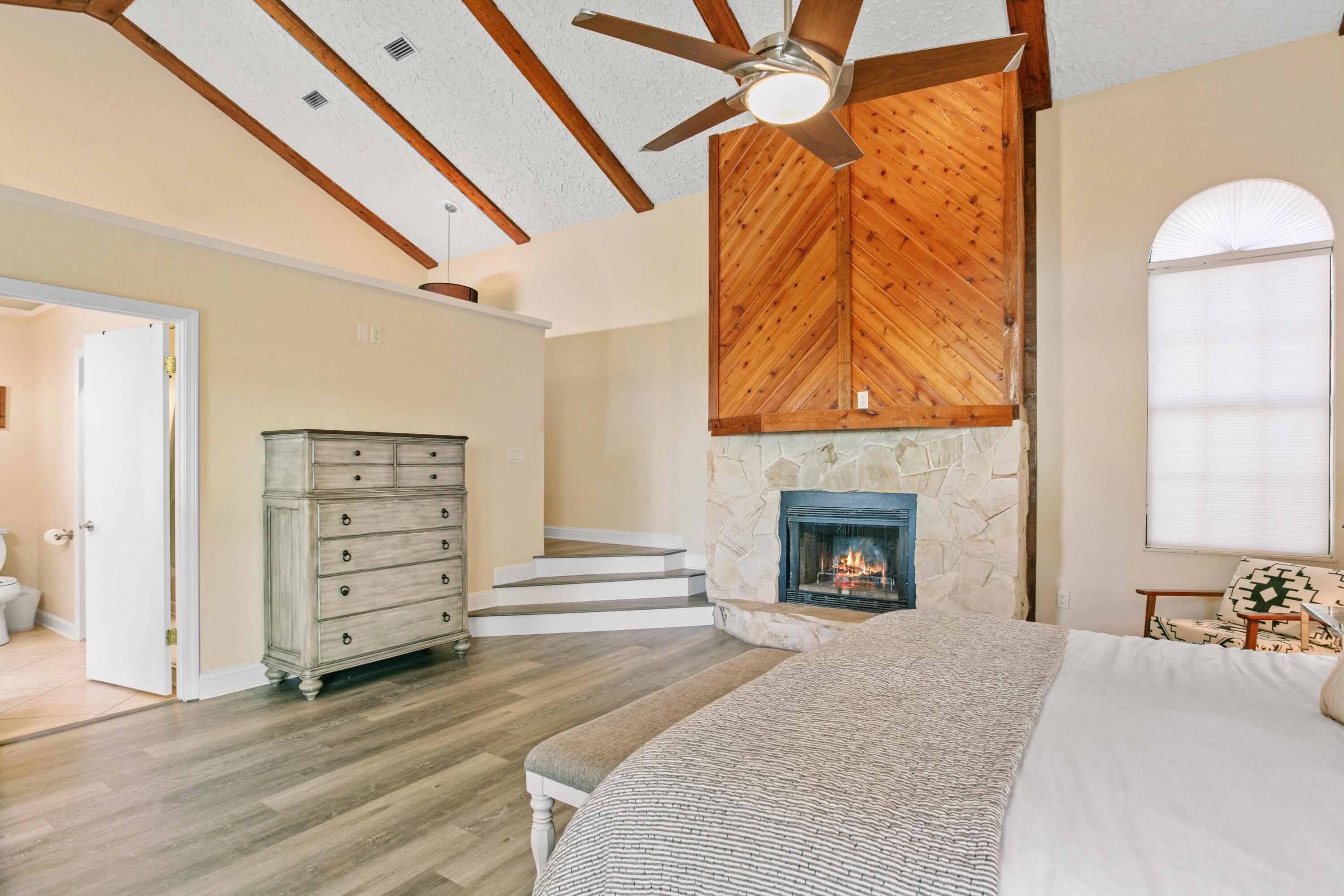 41 Waterview Place Freeport, FL 32439 - Photo 23 of 74 wooden floor fireplace and windows in a room
