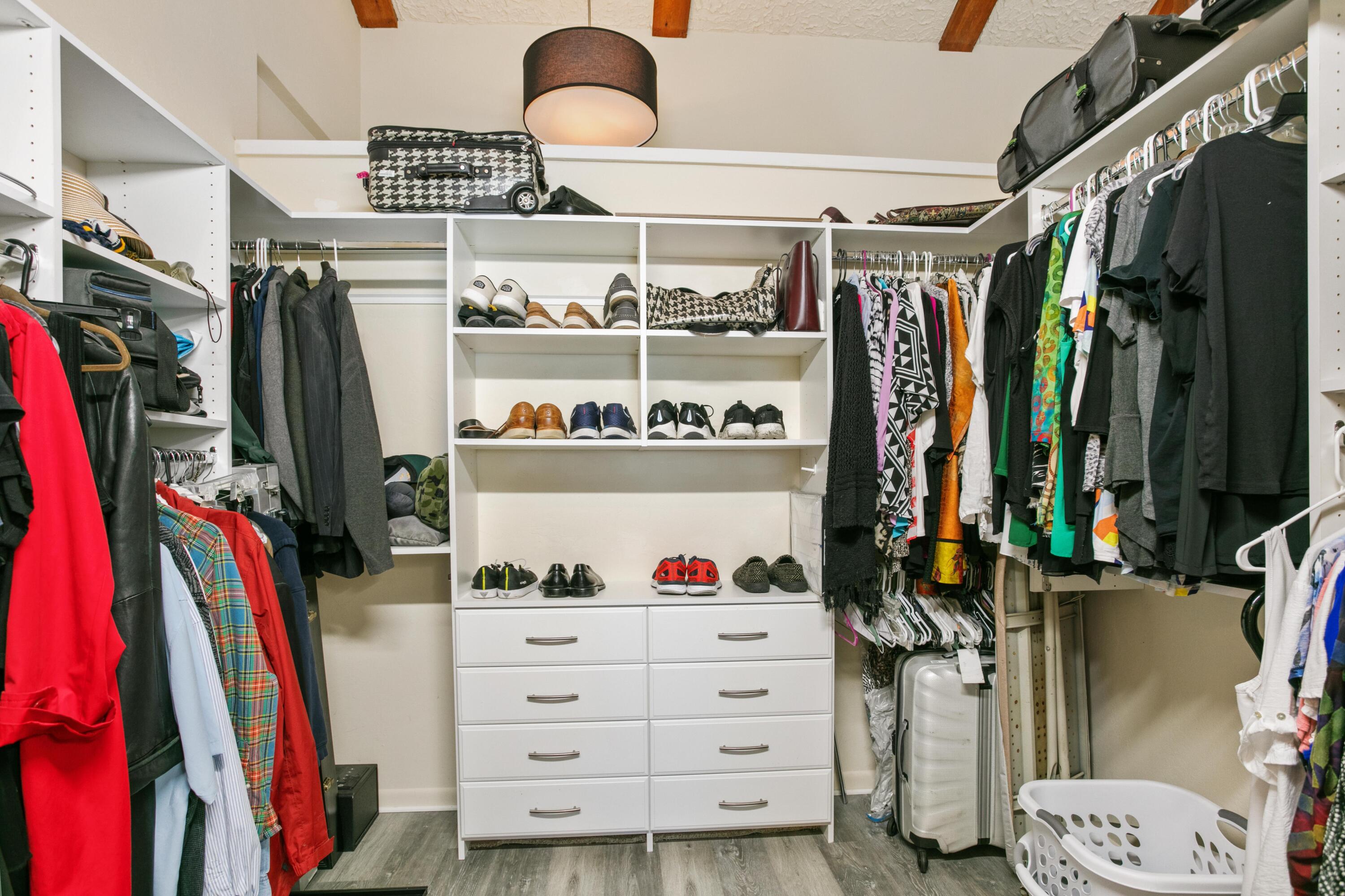 41 Waterview Place Freeport, FL 32439 - Photo 24 of 74 a view of walk in closet with clothes and shoes