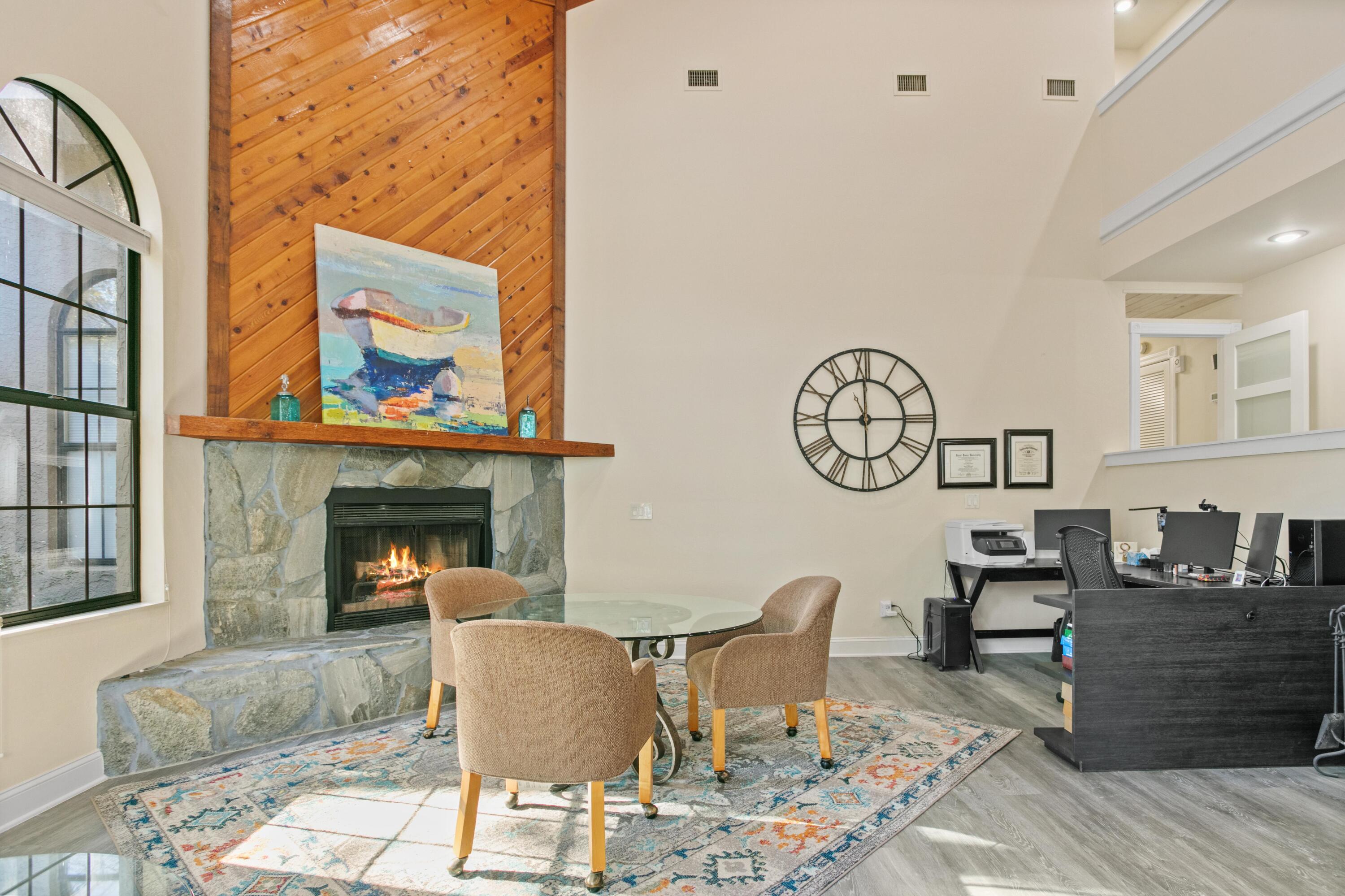 41 Waterview Place Freeport, FL 32439 - Photo 29 of 74 a living room with furniture a clock and a fireplace