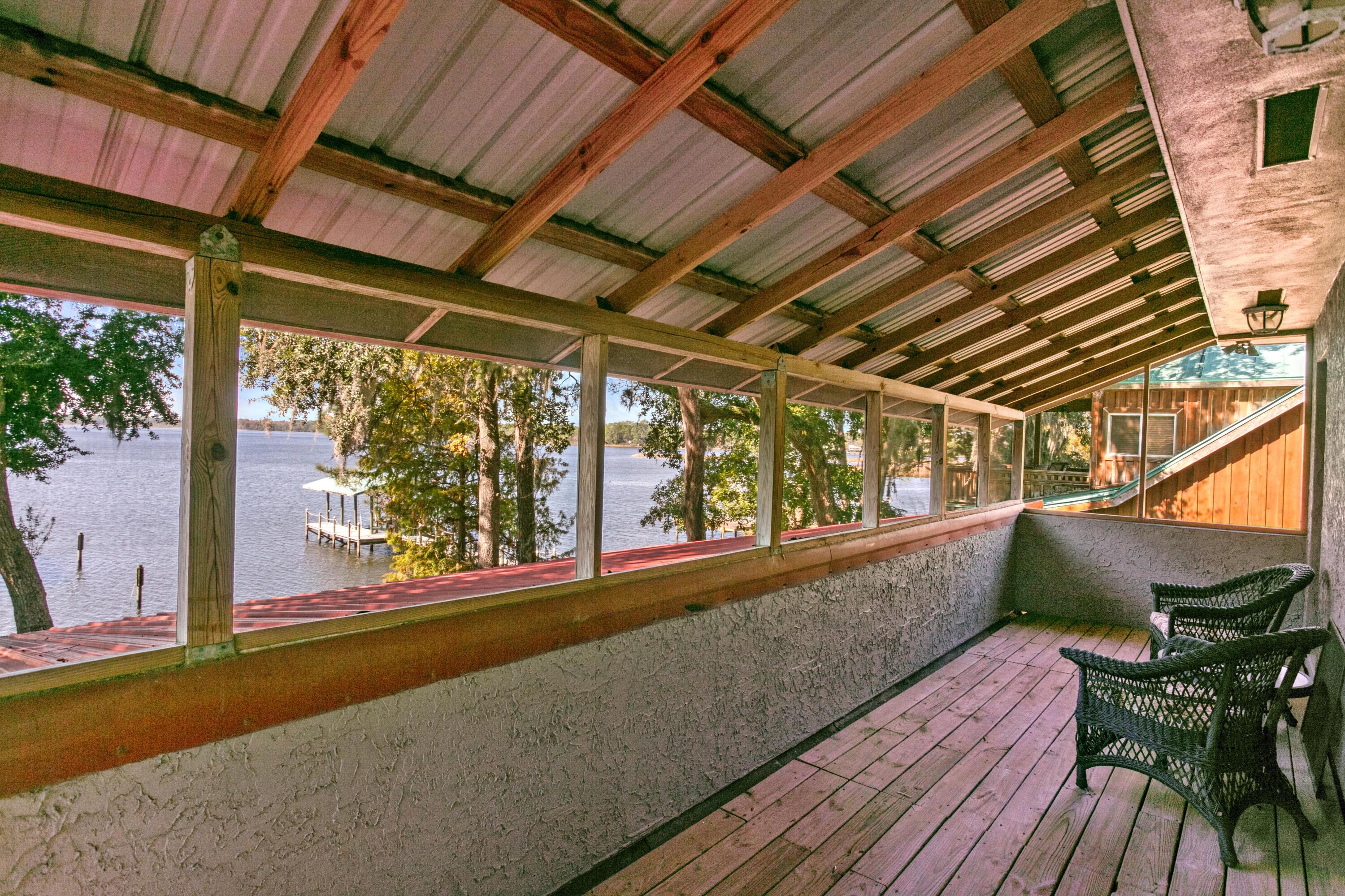 41 Waterview Place Freeport, FL 32439 - Photo 46 of 74 a view of a porch with furniture and a table