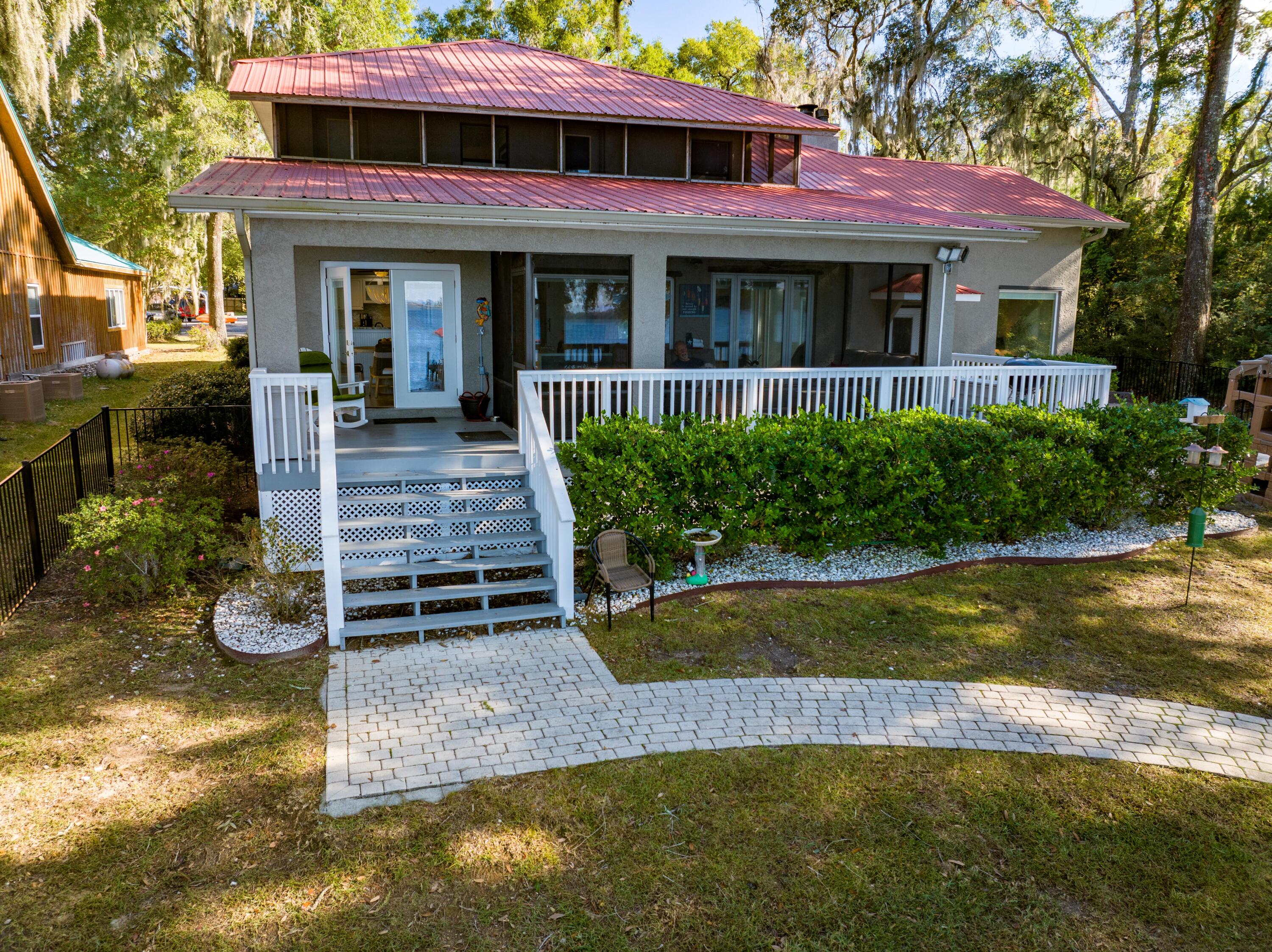 41 Waterview Place Freeport, FL 32439 - Photo 52 of 74 a view of a house with a yard plants and large tree