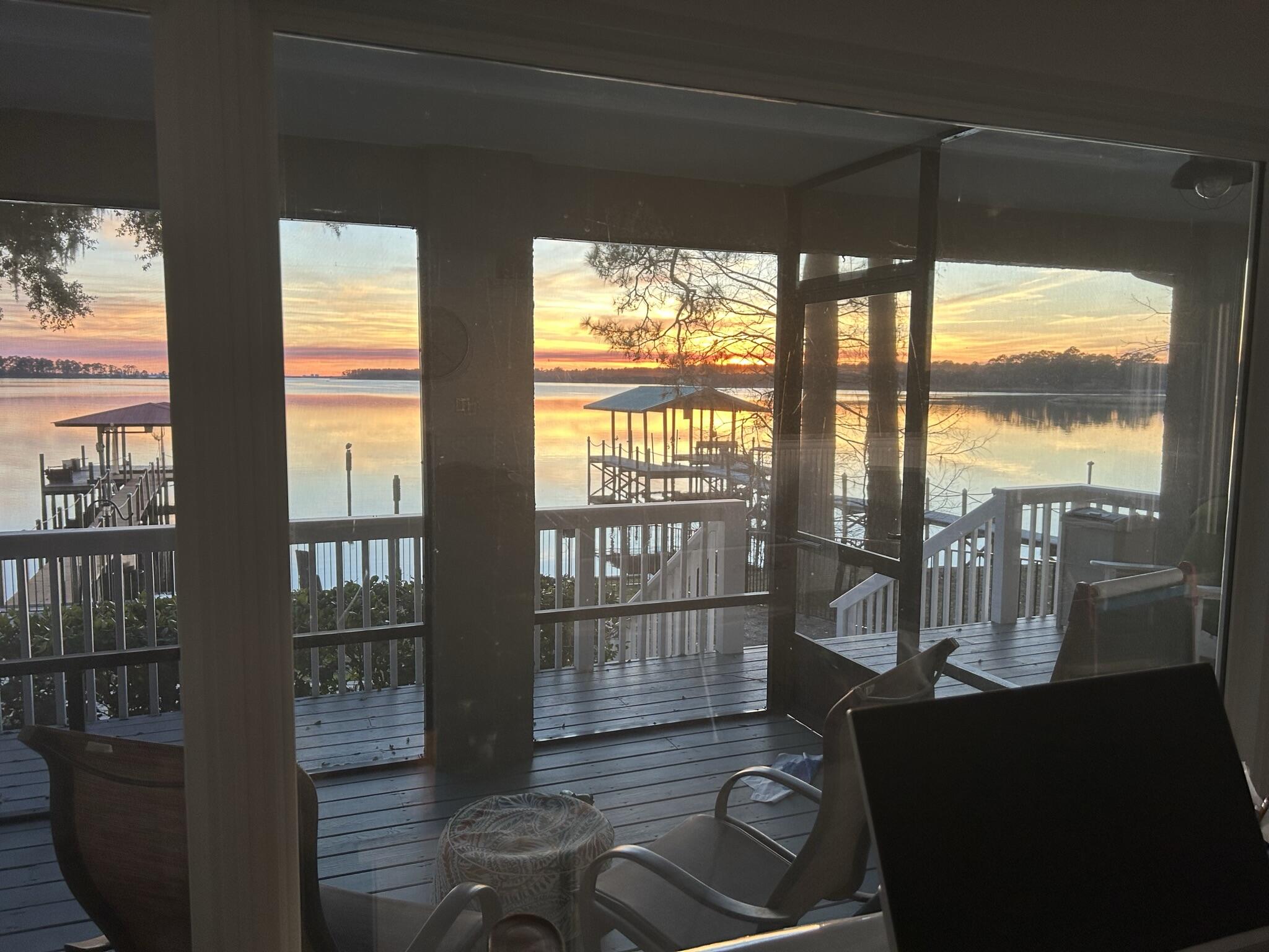 41 Waterview Place Freeport, FL 32439 - Photo 58 of 74 a view of a floor to ceiling window with wooden floor