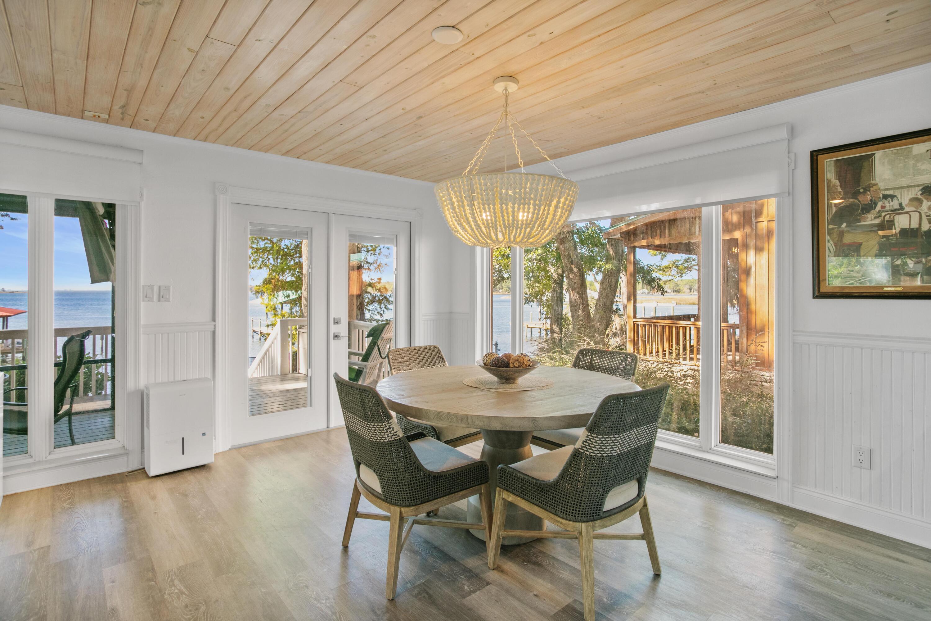 41 Waterview Place Freeport, FL 32439 - Photo 8 of 74 a view of a dining room with furniture wooden floor and chandelier