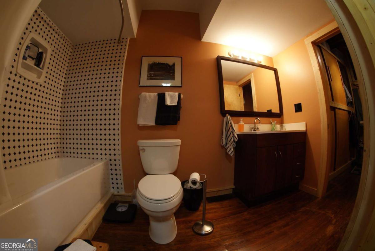 24 Doyle Street Toccoa, GA 30577 - Photo 5 of 7 a bathroom with a toilet a sink and bathtub