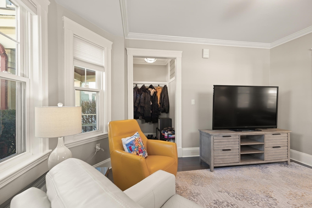 504 Main Street, Unit 1 Watertown, MA 02472 - Photo 11 of 35 a living room with furniture and a flat screen tv