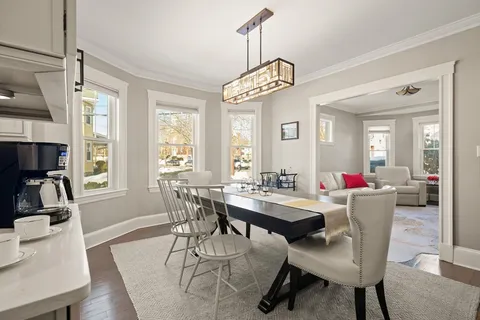 a view of a dining room with furniture window and outside view