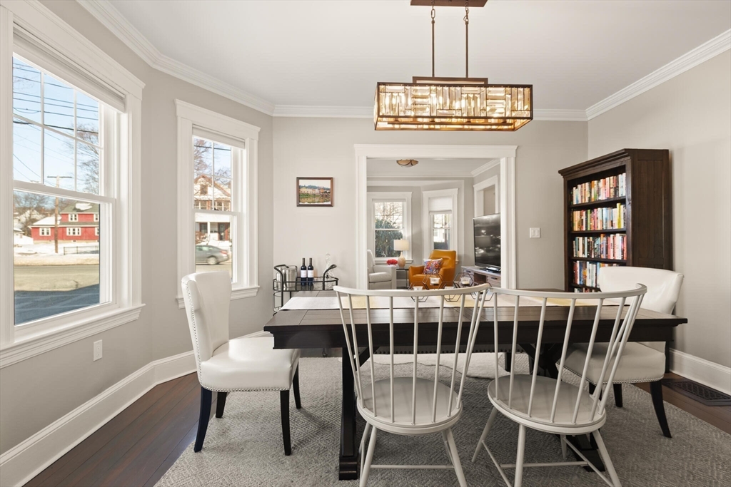 504 Main Street, Unit 1 Watertown, MA 02472 - Photo 16 of 35 a view of a dining room with furniture wooden floor and chandelier