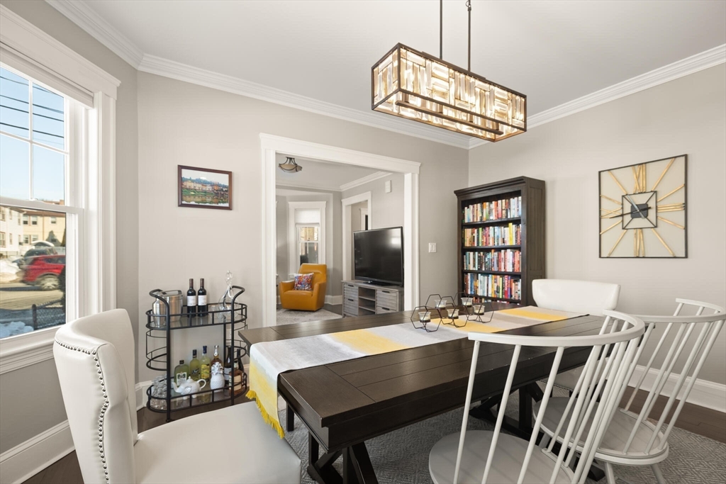 504 Main Street, Unit 1 Watertown, MA 02472 - Photo 17 of 35 a view of a dining room with furniture window and wooden floor