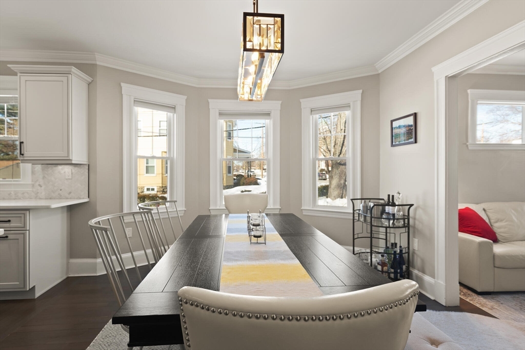 504 Main Street, Unit 1 Watertown, MA 02472 - Photo 18 of 35 a living room with furniture and a window
