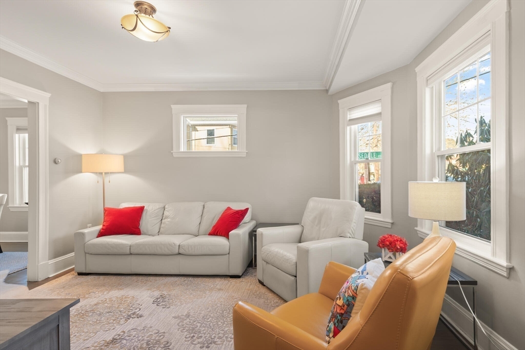 504 Main Street, Unit 1 Watertown, MA 02472 - Photo 10 of 35 a living room with furniture and a couch
