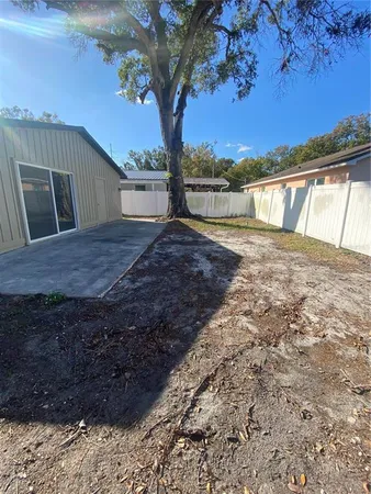 a view of a backyard with tree s