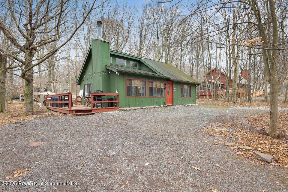 128-2779 Rockway Road Lake Ariel, PA 18436 - Photo 1 of 12 a view of a house with a cars park side of a road