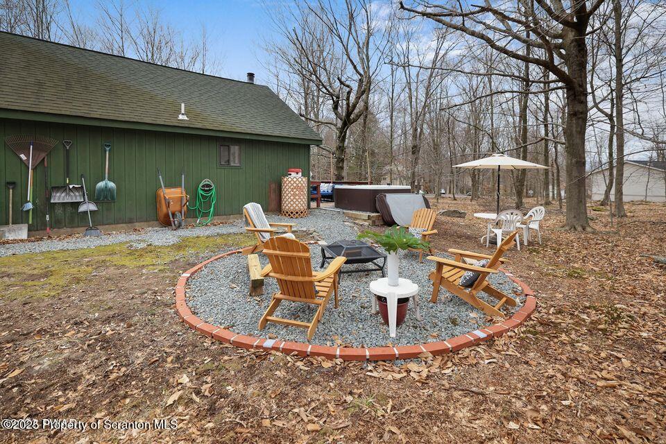 128-2779 Rockway Road Lake Ariel, PA 18436 - Photo 11 of 12 a view of a house with backyard fountain and sitting area