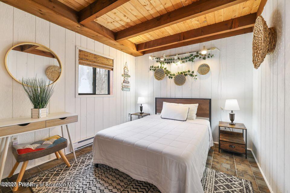 128-2779 Rockway Road Lake Ariel, PA 18436 - Photo 7 of 12 a bedroom with a bed and wooden floor