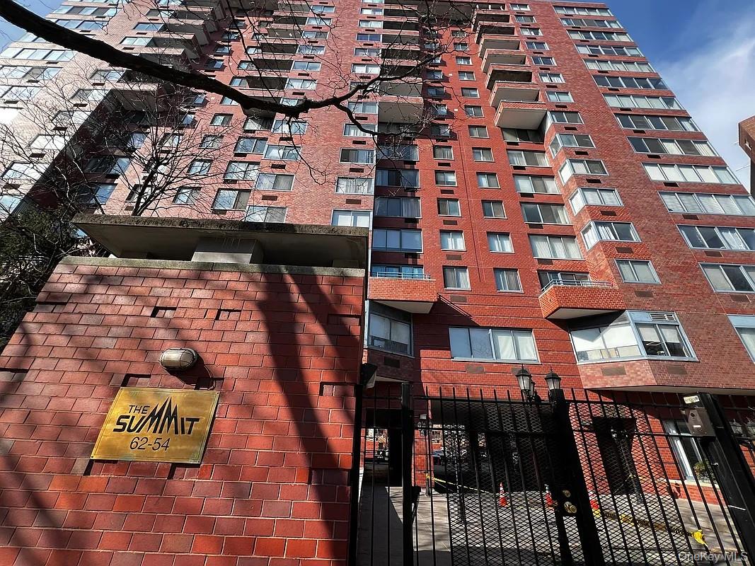 62-54 97th Place, Unit 4G Queens, NY 11374 - Photo 13 of 13 a view of a brick building with many windows