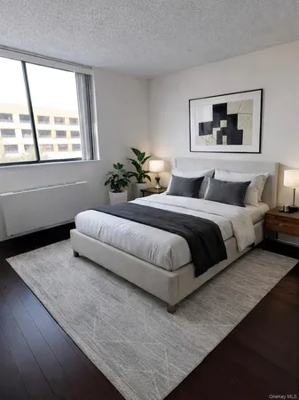 a bedroom with a large bed and a couch