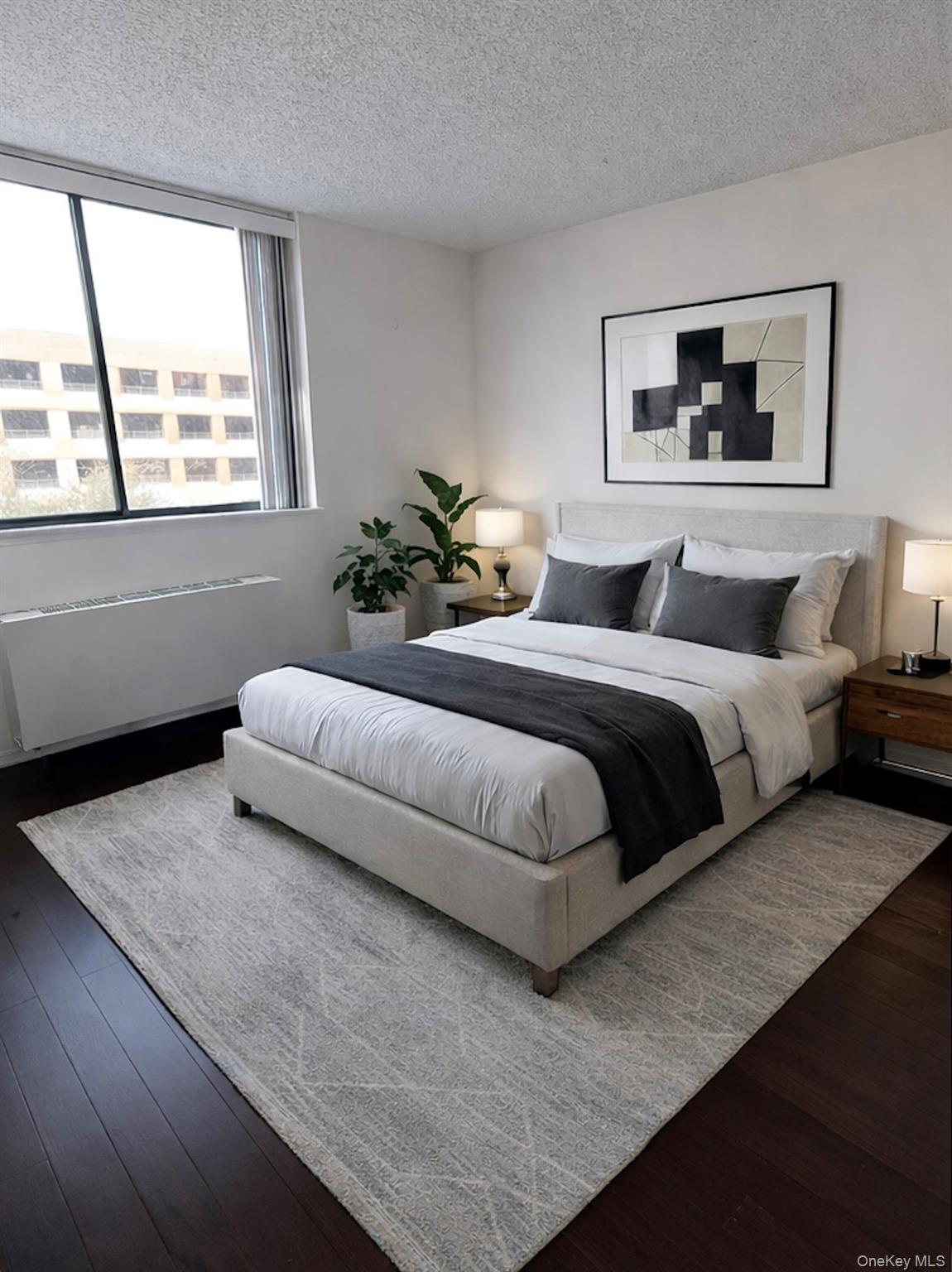 62-54 97th Place, Unit 4G Queens, NY 11374 - Photo 3 of 13 a bedroom with a large bed and a couch