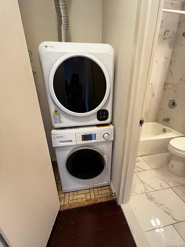 62-54 97th Place, Unit 4G Queens, NY 11374 - Photo 5 of 13 a utility room with dryer and washer