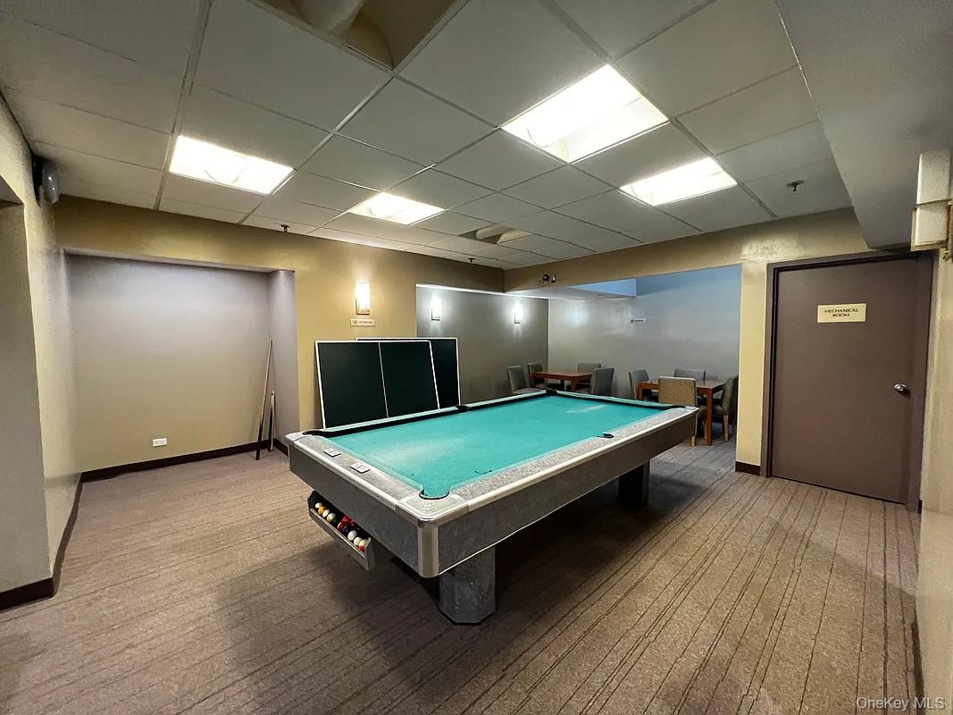 62-54 97th Place, Unit 4G Queens, NY 11374 - Photo 7 of 13 a room with pool tables and wooden floor