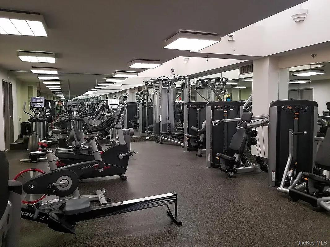 62-54 97th Place, Unit 4G Queens, NY 11374 - Photo 9 of 13 a view of a room with gym equipment