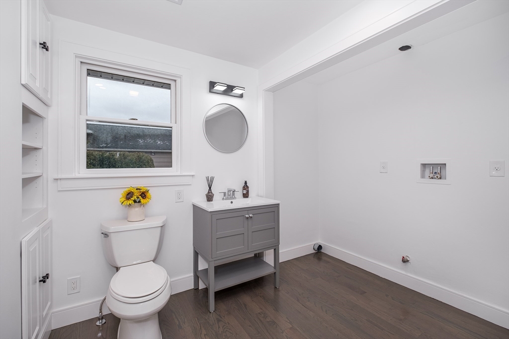 26 Harris Avenue Wellesley, MA 02481 - Photo 15 of 37 a bathroom with a toilet sink and mirror