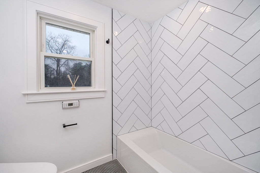 26 Harris Avenue Wellesley, MA 02481 - Photo 18 of 37 a bathroom with a bathtub and shower