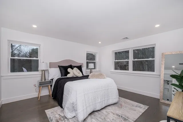 a bed room with a bed and a window