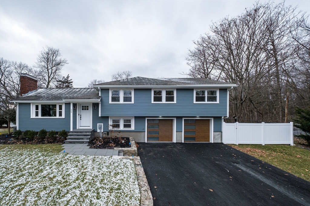 26 Harris Avenue Wellesley, MA 02481 - Photo 23 of 37 a front view of a house with a yard