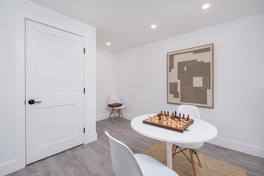 26 Harris Avenue Wellesley, MA 02481 - Photo 24 of 37 a living room with furniture and a table