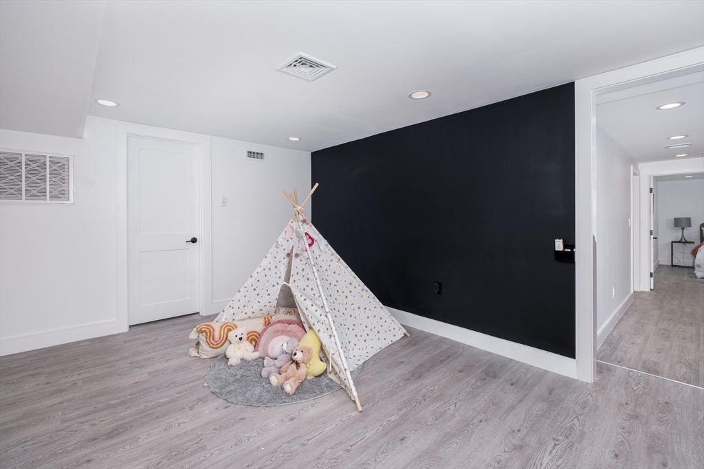 26 Harris Avenue Wellesley, MA 02481 - Photo 29 of 37 a view of a livingroom with wooden floor and entryway