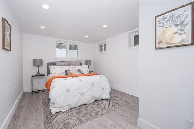 a bedroom with a bed and a painting