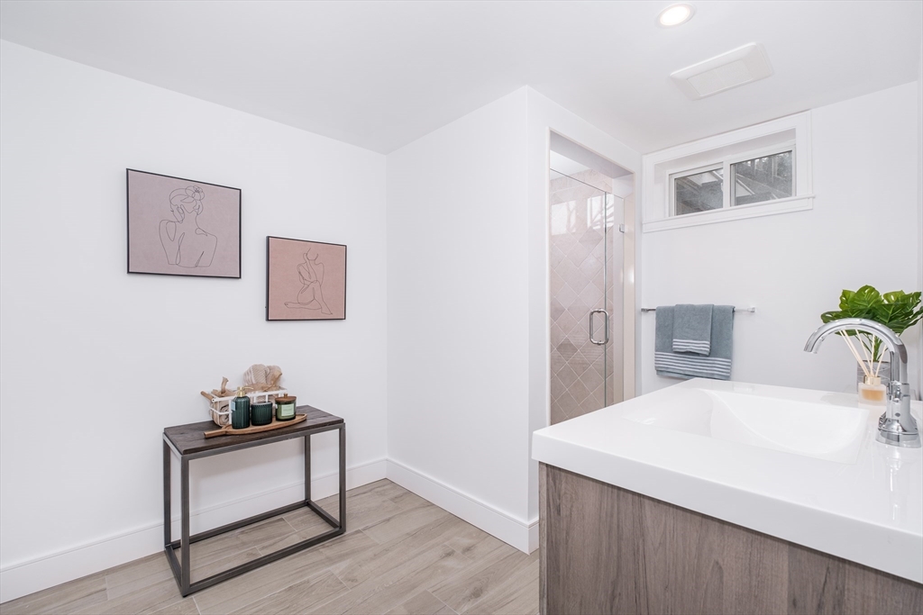 26 Harris Avenue Wellesley, MA 02481 - Photo 32 of 37 a room with a table and a chair