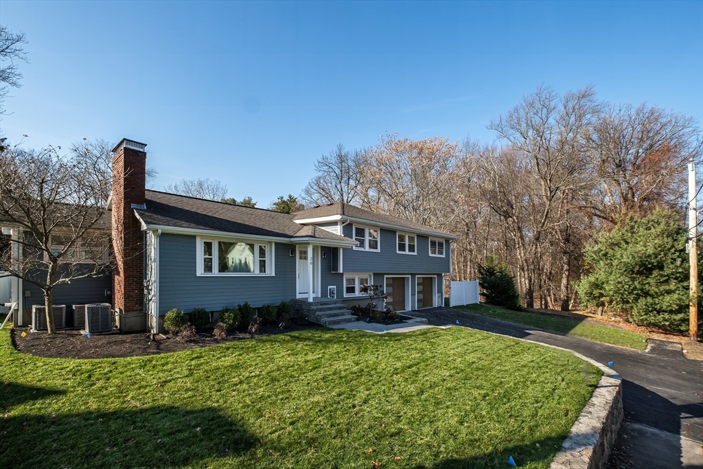 26 Harris Avenue Wellesley, MA 02481 - Photo 35 of 37 a front view of a house with a garden