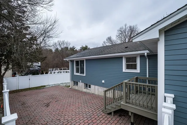 a view of backyard with a deck and wooden floor