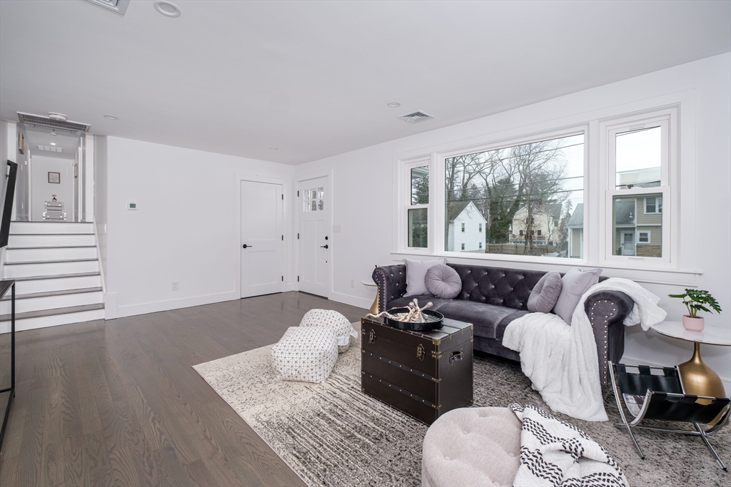 26 Harris Avenue Wellesley, MA 02481 - Photo 4 of 37 a living room with furniture and a large window