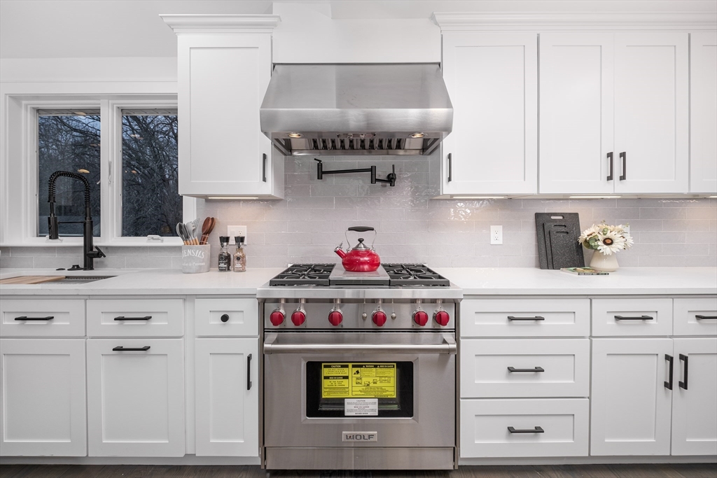 26 Harris Avenue Wellesley, MA 02481 - Photo 7 of 37 a kitchen with cabinets and a stove