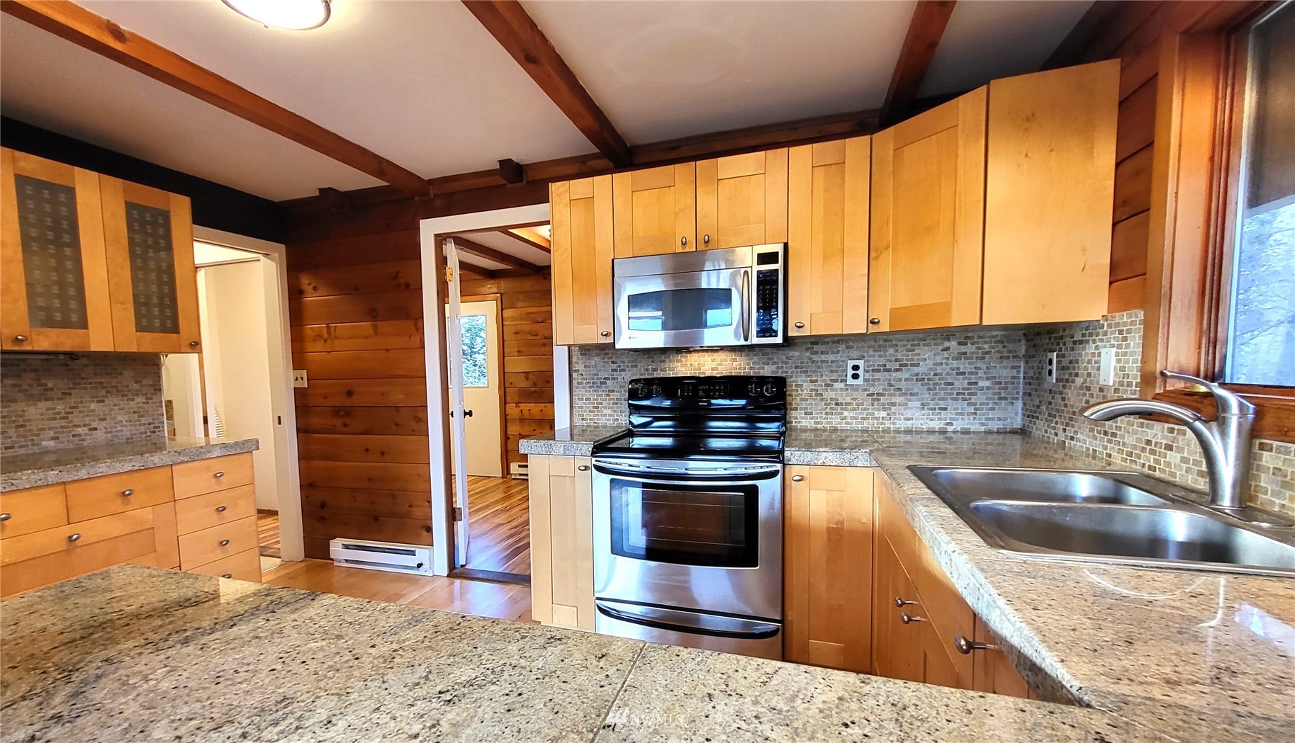 1040 Spath Road Sequim, WA 98382 - Photo 11 of 34 a kitchen with stainless steel appliances granite countertop a sink stove and refrigerator