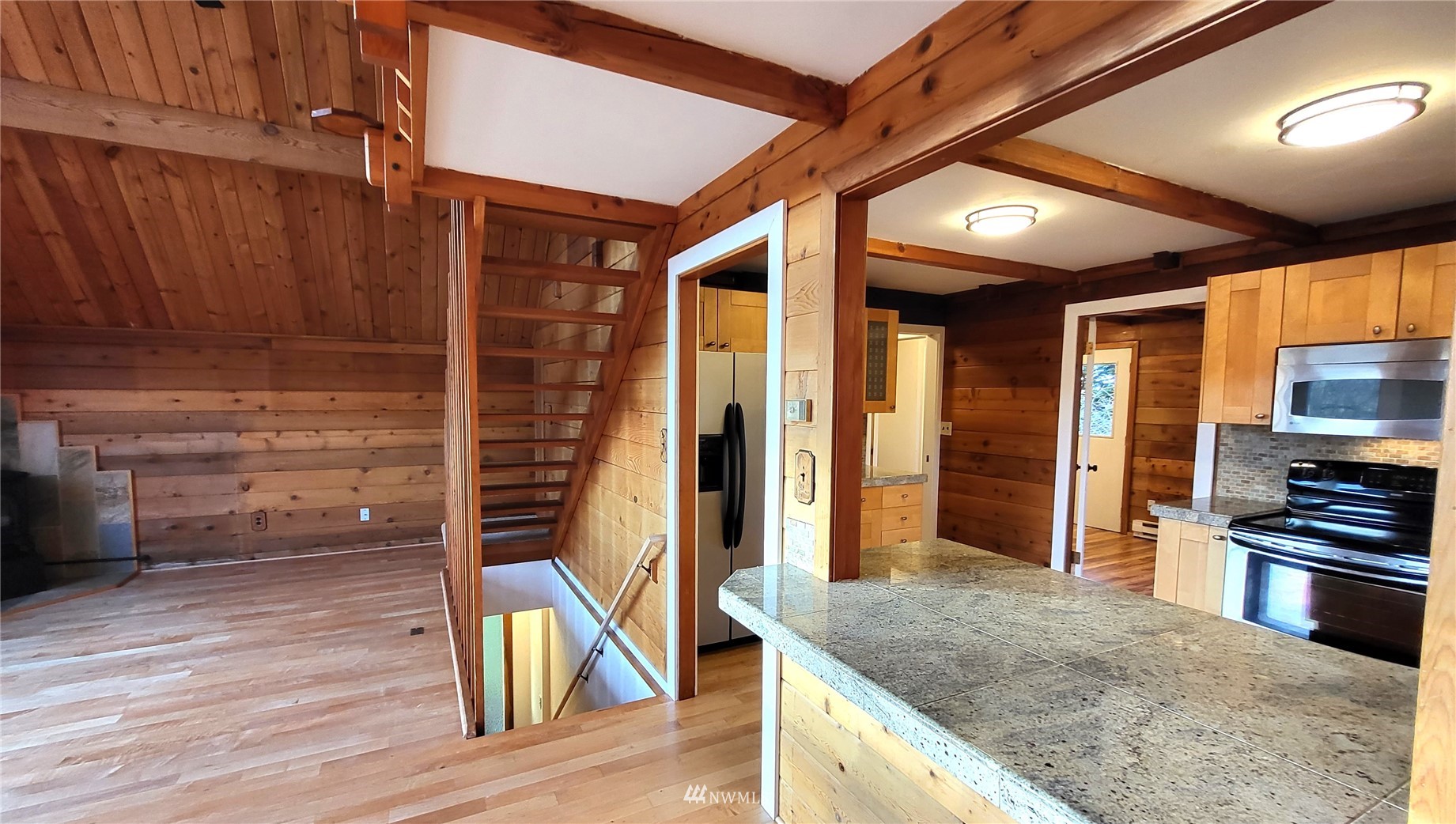 1040 Spath Road Sequim, WA 98382 - Photo 12 of 34 a kitchen with stainless steel appliances granite countertop a stove and a refrigerator