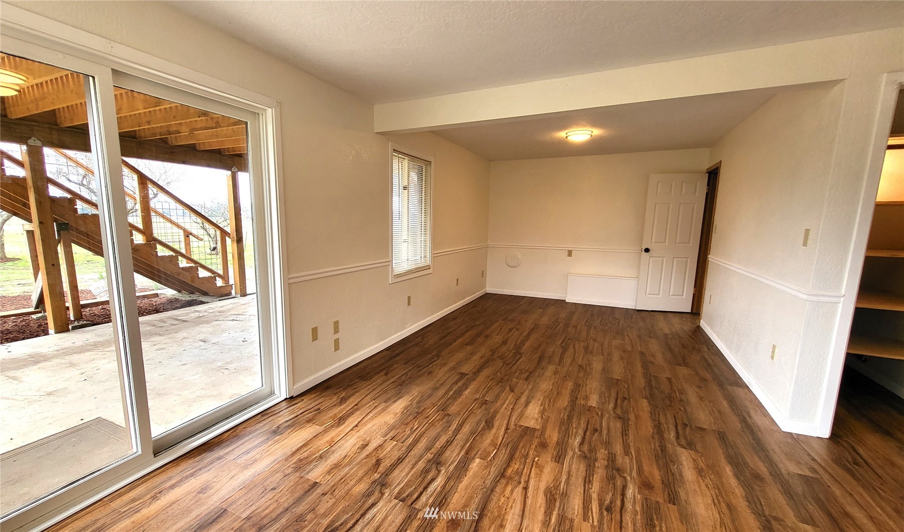 1040 Spath Road Sequim, WA 98382 - Photo 19 of 34 a view of empty room with wooden floor and fan