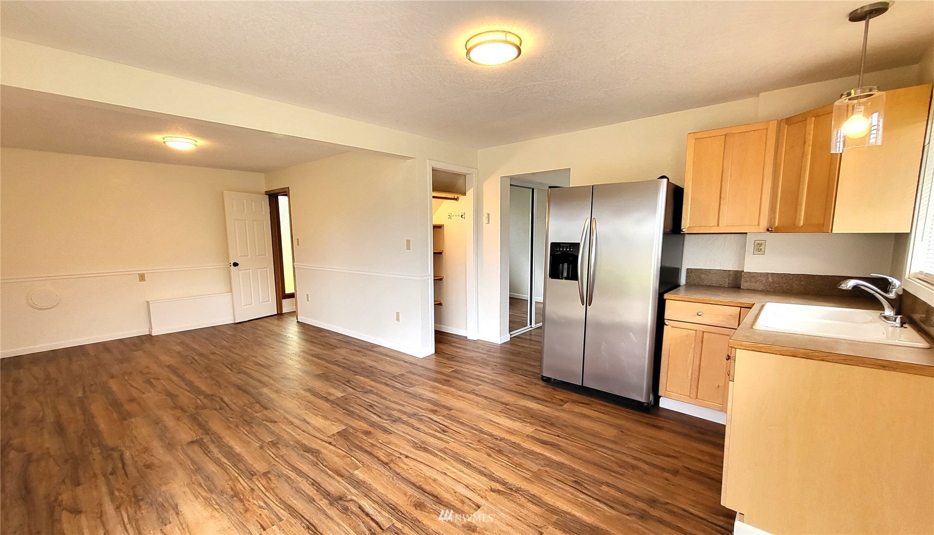 1040 Spath Road Sequim, WA 98382 - Photo 20 of 34 a view of a kitchen with a sink and a refrigerator
