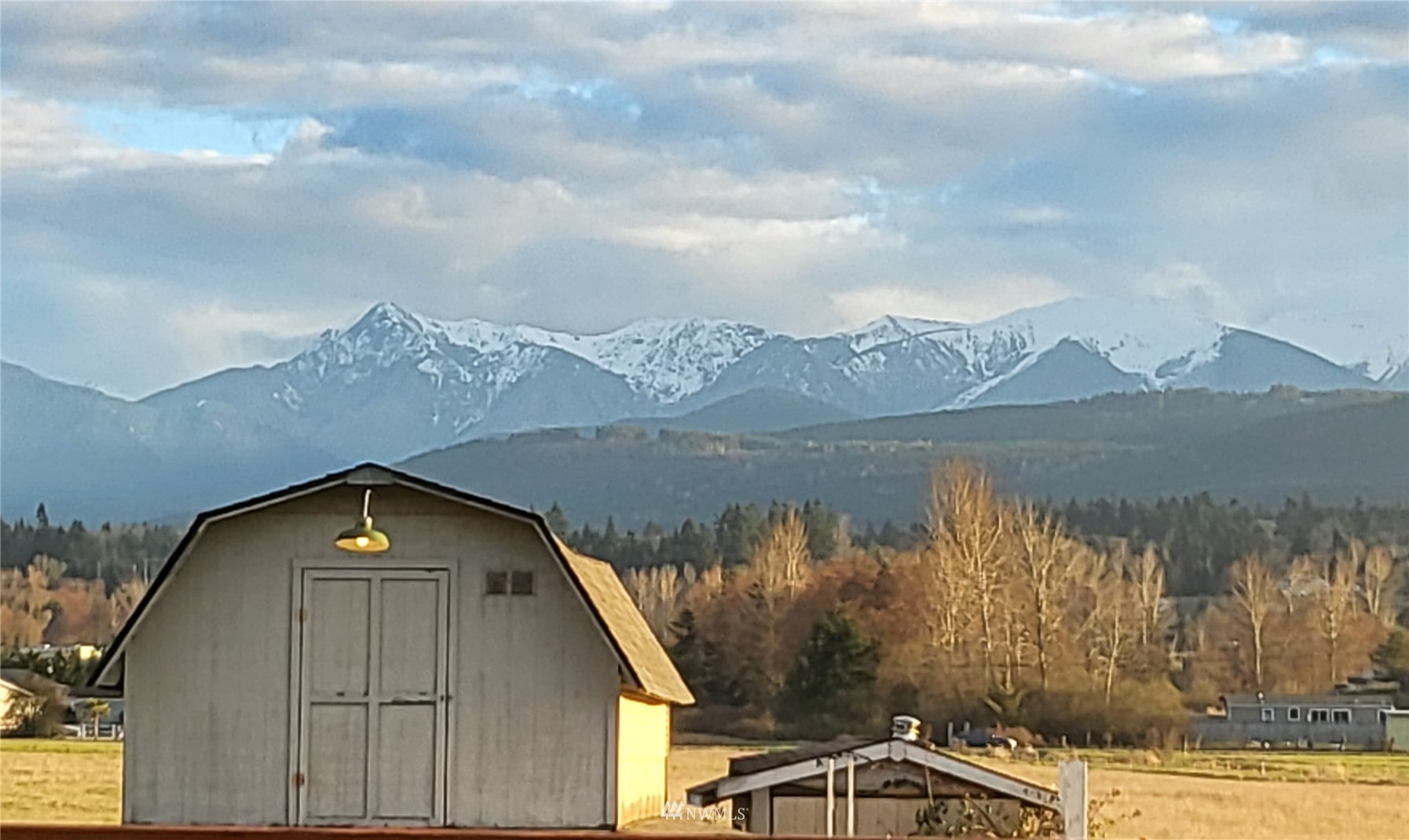 1040 Spath Road Sequim, WA 98382 - Photo 2 of 34 a view of a lake in front of house