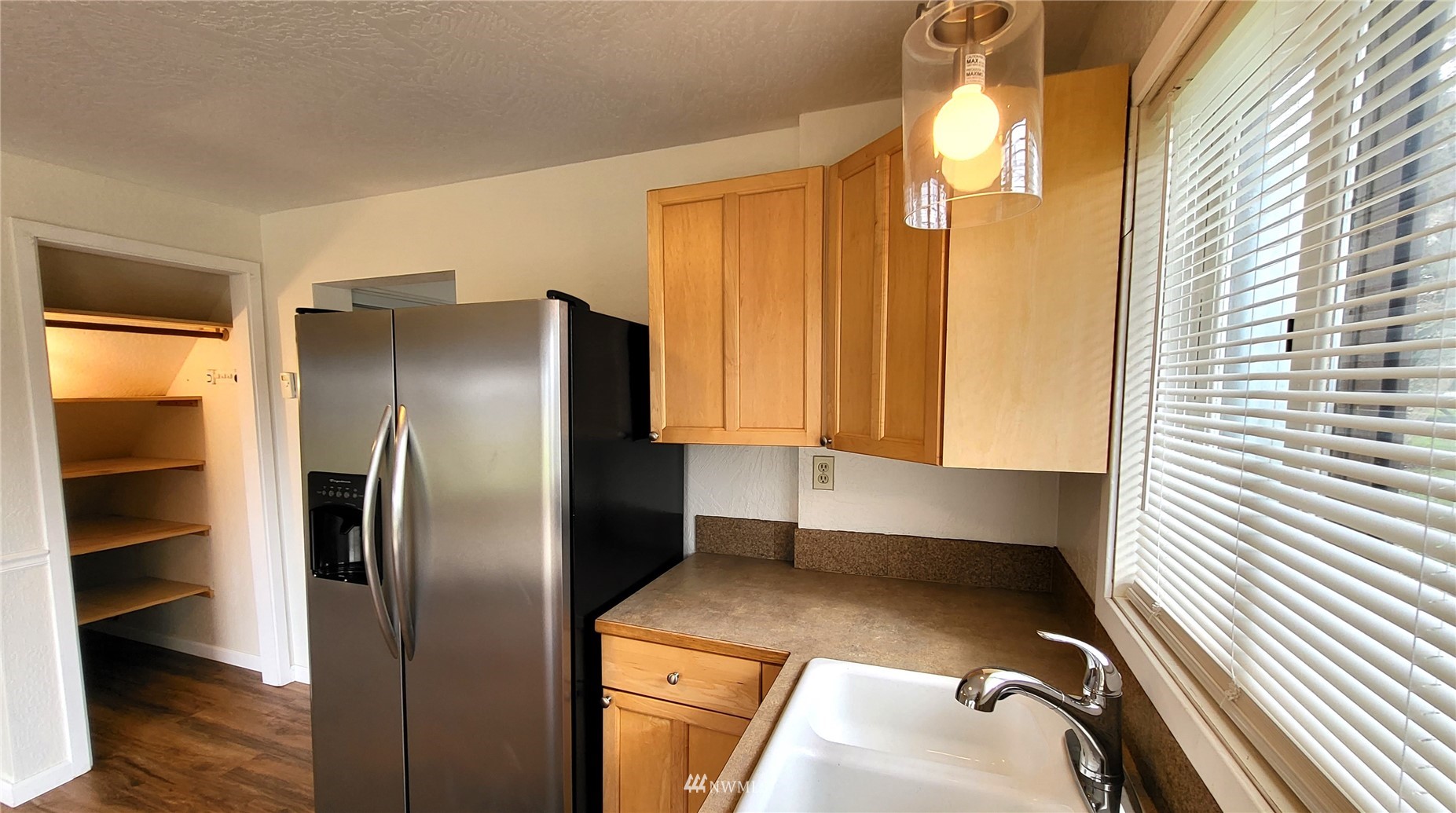 1040 Spath Road Sequim, WA 98382 - Photo 22 of 34 a kitchen with refrigerator and window