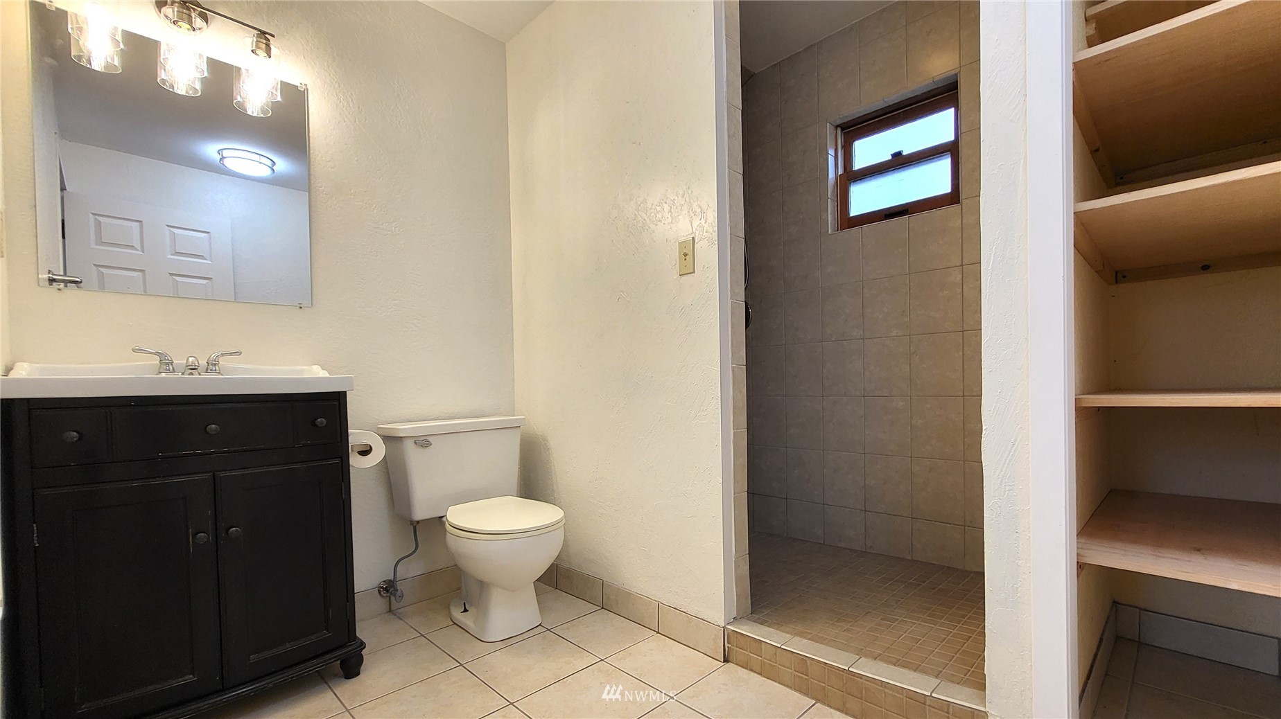 1040 Spath Road Sequim, WA 98382 - Photo 25 of 34 a bathroom with a sink a toilet and a mirror