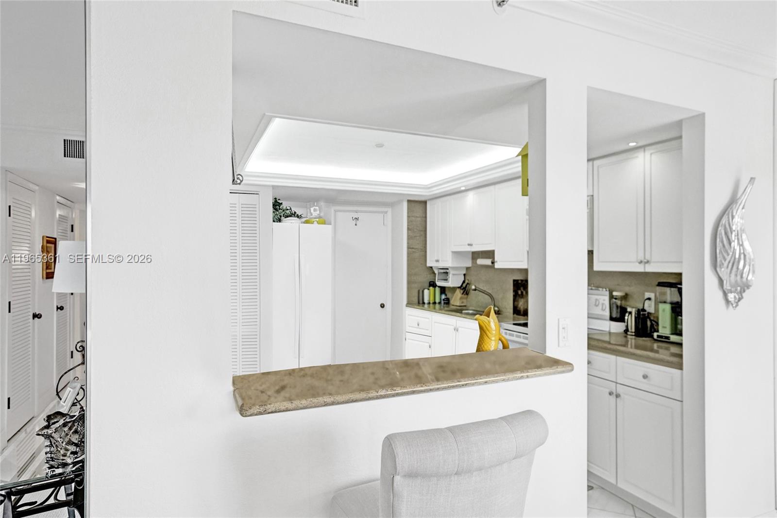501 North Riverside Drive, Unit 802 Pompano Beach, FL 33062 - Photo 16 of 70 a kitchen with stainless steel appliances granite countertop a sink and cabinets
