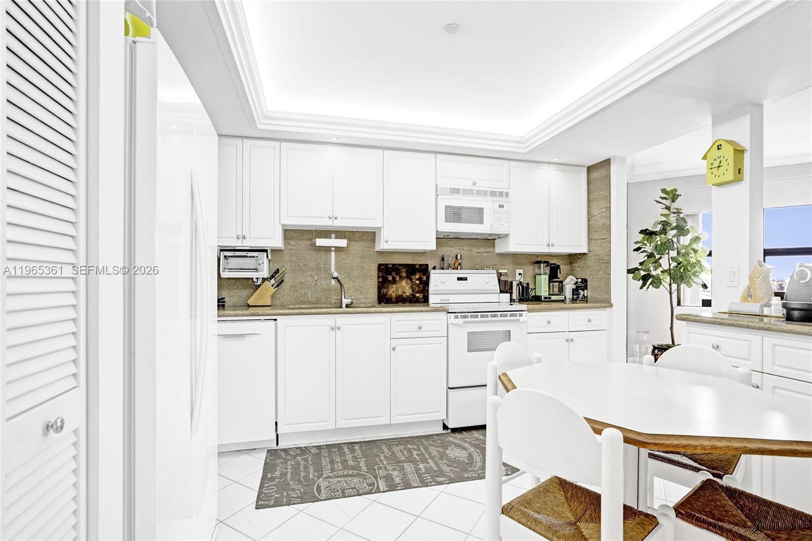 501 North Riverside Drive, Unit 802 Pompano Beach, FL 33062 - Photo 18 of 70 a kitchen with stainless steel appliances granite countertop a stove a sink and a refrigerator