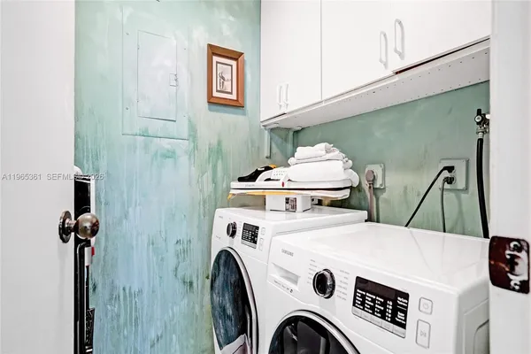 a bedroom with a bed and a potted plant
