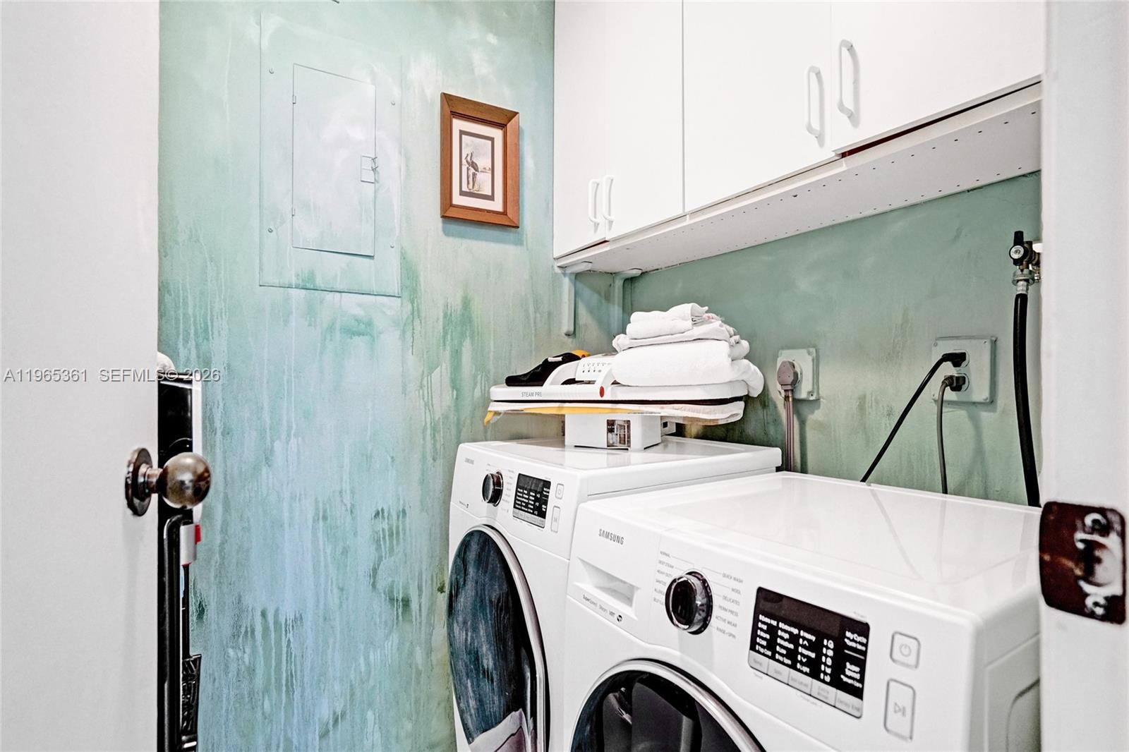 501 North Riverside Drive, Unit 802 Pompano Beach, FL 33062 - Photo 22 of 70 a utility room with dryer and washer