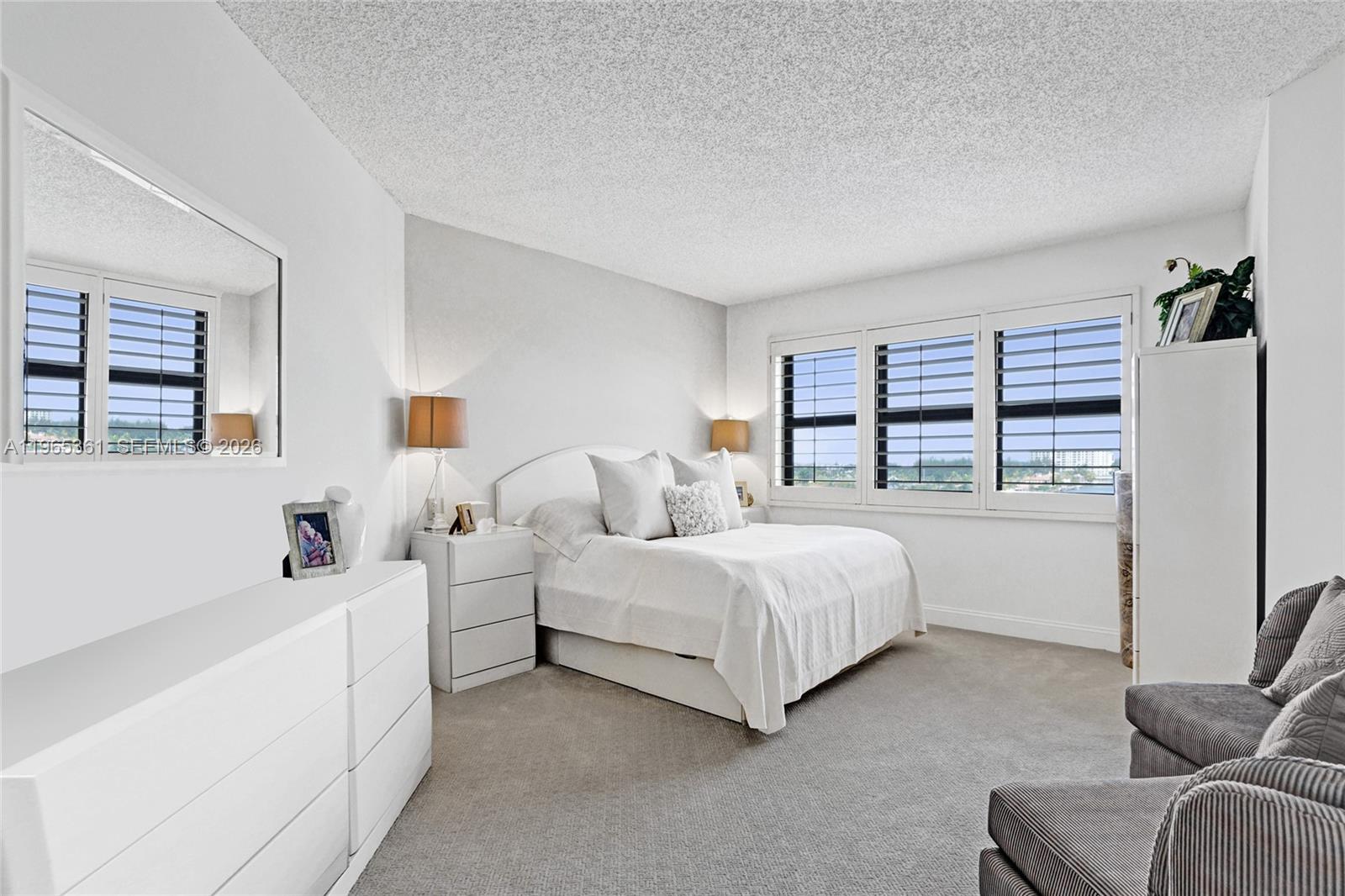 501 North Riverside Drive, Unit 802 Pompano Beach, FL 33062 - Photo 23 of 70 a bed room with a bed and a couch