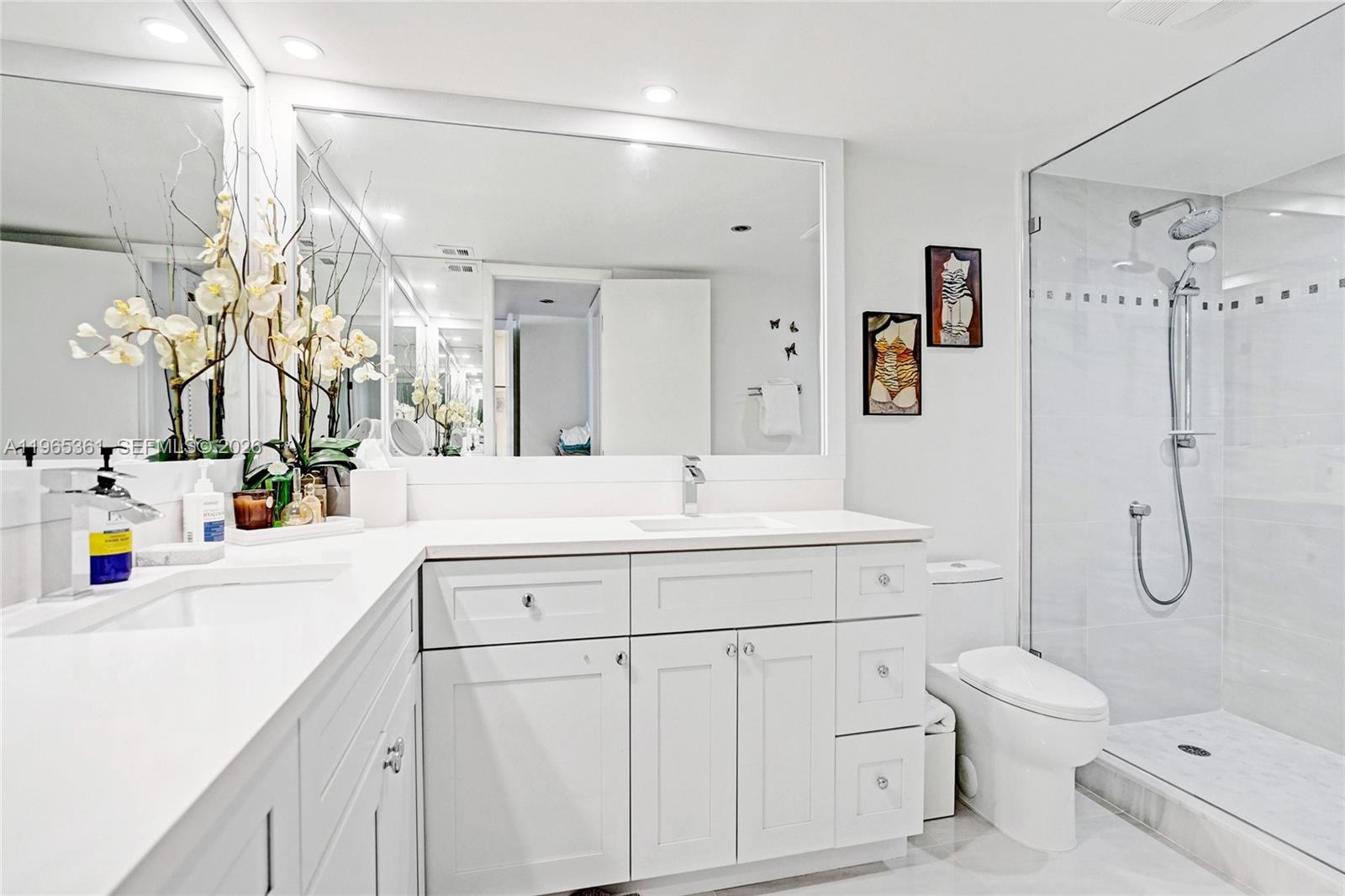 501 North Riverside Drive, Unit 802 Pompano Beach, FL 33062 - Photo 28 of 70 a bathroom with a sink a toilet and shower