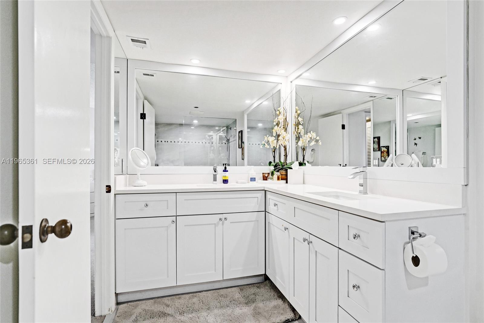 501 North Riverside Drive, Unit 802 Pompano Beach, FL 33062 - Photo 29 of 70 a spacious bathroom with a double vanity sink mirror and